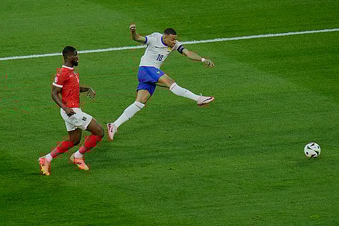 Kevin Danso and Kylian Mbappe